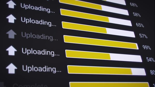 Video animation of the process of uploading multiple files from the Internet on a computer monitor screen. A computer monitor displaying information about the data upload in real time, including perce