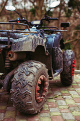 Muddy ATV parked outdoors rear view © VlaDee