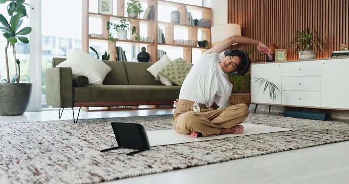Man, stretching and headphones with tablet on yoga mat for online tutorial or exercise in home. Male person, warm up and virtual guide with technology or workout app for health and wellness tips