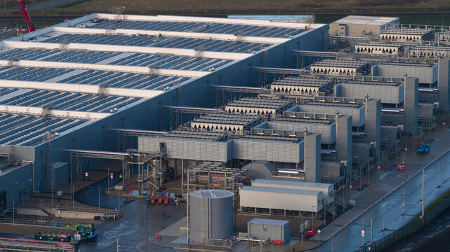 Data center building featuring solar panels and advanced cooling systems