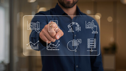 Man interacting with a futuristic transparent screen displaying business analytics, automation, and artificial intelligence icons.