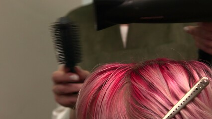 Pink Hair Is Being Styled, Professional Salon Stylist Carefully Styles Pink Hair With Tools. Media