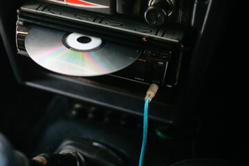 close up of dvd player with disc on head unit audio car © ozzuboy