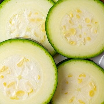 Macro close up zucchini slices showing organic vegetable texture and natural food pattern