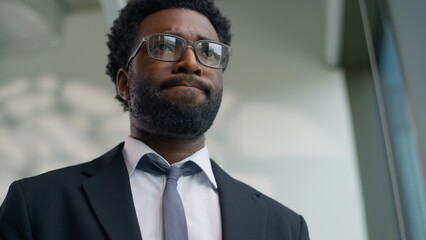 Close up frustrated African American business man bad news reaction problem ethnic businessman feeling sadness trouble tired male entrepreneur executive work failure frustration emotion in office