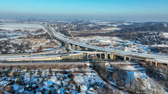 Krakow, Poland. Mistrzejowice highway interchange under construction in winter. Last fragment of motorway beltway around Krakow and joining S7 from Warsaw to A4. State in January 2026. Aerial 4K video