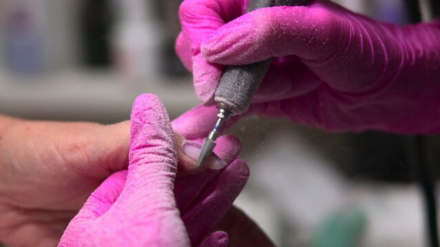 Nail Artist Refining, Expert Manicurist Carefully Sculpts Nails Using Rotary Tool For Flawless Finish. Media