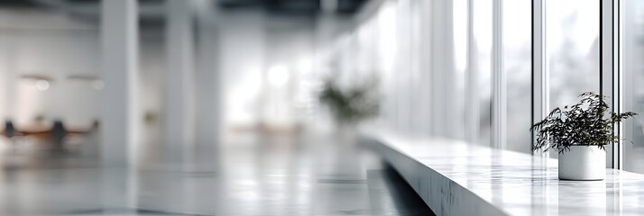 A blurred modern office interior with a long hallway, panoramic windows, and reflective floors