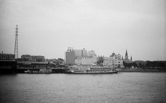 New Orleans, USA - circa 1976: steamboat Natchez on background  building Jax and St. Louis Cathedral