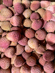 Fresh pink lychee in a basket.