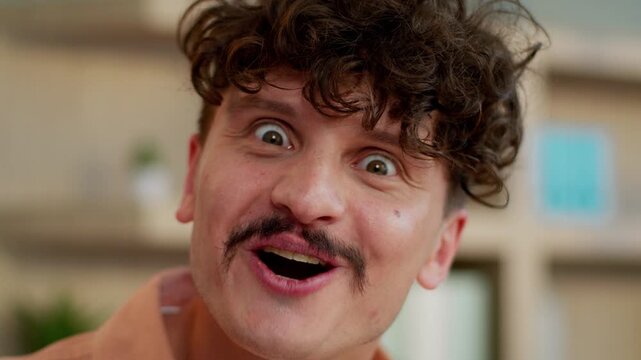 Portrait amazed Caucasian business man emotional businessman wonder surprised saying wow amazing reaction male guy excited looking at camera satisfied blink eye blinking unexpected emotion in office