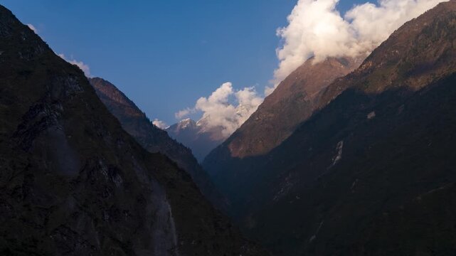 Time-lapse of majestic Himalayan mountains as clouds drift and light changes, revealing dramatic peaks, shifting shadows, and the raw beauty of high-altitude landscapes in Nepal.