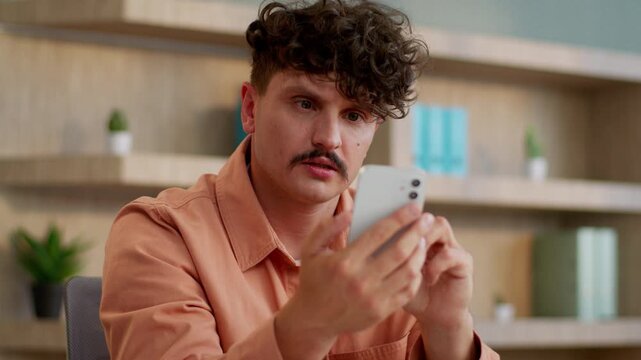 Caucasian business man typing mobile phone chatting smartphone app serious businessman guy male worker manager chatting social media using web application specialist scrolling cellphone in office