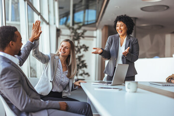 Business Team Celebration With High Five In Modern Bright Office After Successful Meeting