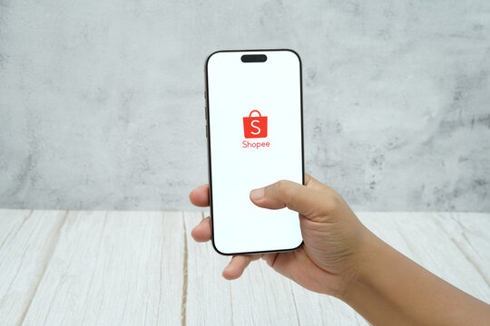 Rawang, Selangor, Malaysia - &lrm;January 21, 2026 - Hand holding smartphone displaying Shopee mobile application logo. e-commerce platform, online shopping, and digital marketplace usage in Malaysia.