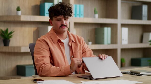 Sad Caucasian businessman typing computer business man tired close laptop dissatisfied with bad online result feeling fatigued male guy entrepreneur complete boring job internet work burnout in office