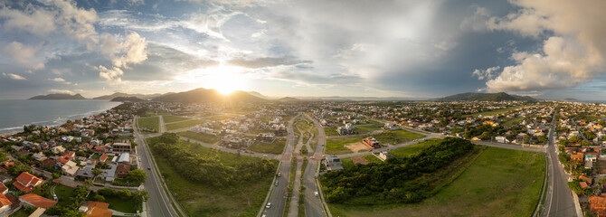 Aerial panorama of the Atlantic ocean coast and calm green neighborhood near the city of Florianopolis in Brazil © Dudarev Mikhail