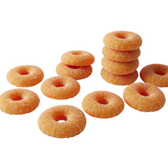 Stacks and groups of orange gummy candy rings, transparency included