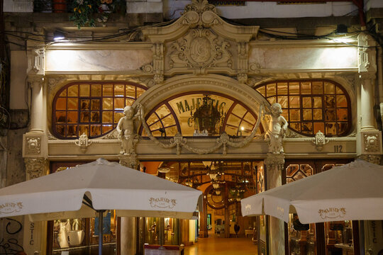 Majestic cafe beautiful ornate belle epoque coffee house at night, Porto, Portugal