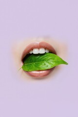 a woman's mouth with a leaf in her mouth