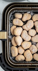 Uncooked Frozen Chicken Nuggets Ready for Preparation in a Modern Air Fryer