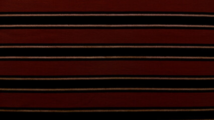 striped burgundy fabric texture with black gold accents closeup luxurious horizontal pattern elegant background for wallpaper or fashion banner