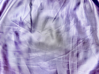 ethereal purple silk fabric texture with flowing wrinkles and soft luminous gradients for abstract wallpaper or banner background
