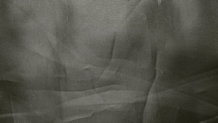 closeup black tulle mesh fabric texture with elegant wrinkles and subtle folds for sophisticated design backgrounds and wallpapers