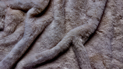 luxurious soft gray fur texture folding in elegant waves with tactile sheen for cozy wallpaper background