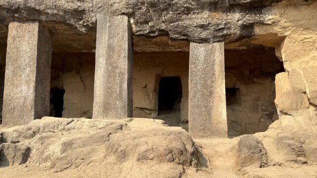 Rock-cut temple colonnade at Elephanta Caves on Elephanta Island, Mumbai Harbor, Maharashtra, India.
