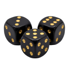 Three black dice with gold spots resting on a white surface
