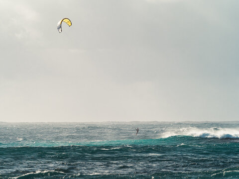Kitesurfer Riding Waves in Dynamic Ocean Action Scene