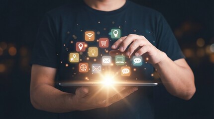 Man holding tablet with glowing digital app icons emerging, abstract bokeh background