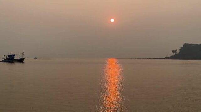 Sunset over the Arabian Sea in Panaji Goa India, calm coastal landscape at dusk

