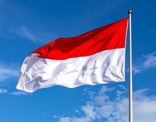Indonesian Flag Waving Against Clear Blue Sky