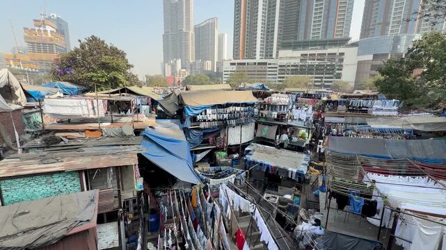 Dhobi Ghat open-air laundry district with high-rise skyline in Mumbai, Maharashtra, India.
