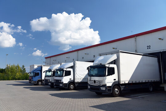 Trucks loading at a depot of a forwarding agency - Transport and logistics in goods trade
