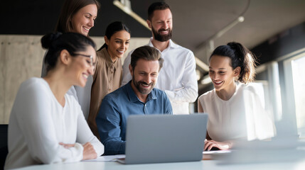 Fototapeta premium a small team of creative professionals discussing ideas while looking at a laptop in a modern office, medium shot, natural smiles