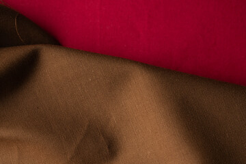 Warm brown cloth with red fabric creating elegant contrast