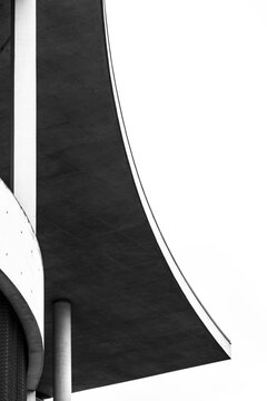 Modern abstract architecture curve in concrete with shadow contrast and geometry showing minimalism through detail and negative space