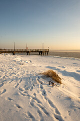 Fototapeta premium Winter coastline of Hel Peninsula with frozen Baltic Sea. Kuznica village in Poland, Europe