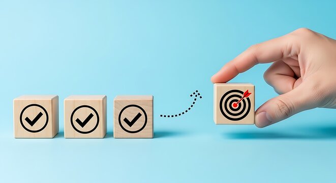 Human hand aligning a goal block with a series of checkmarks to symbolize successful project management and completion.