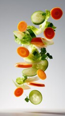 Floating vertical display of fresh vegetables cucumber rounds, carrot coins, lettuce, avocado slices against