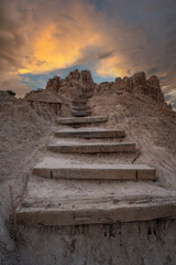 rocky stairs leading towards a colorful sky at Cathedral Gorge State Park in Nevada 