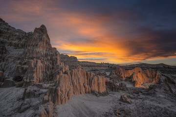Sunrise colors over illuminated rock formations in Cathedral Gorge State Park Nevada