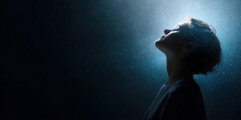 Fototapeta premium Young caucasian female gazing upward in starry night sky