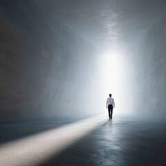 Obraz premium Male walking towards light in minimalistic tunnel symbolizing hope and new beginnings