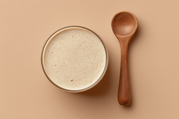 Creamy Peanut Butter Milkshake Flat Lay on Rustic Wooden Surface with Tan Background