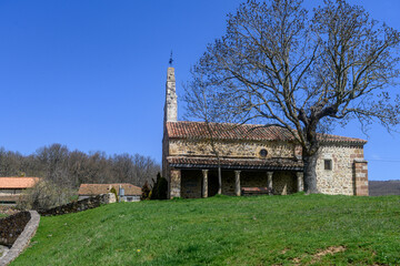 Naklejka premium Stone Church of San Miguel in Verde?a with bell gable