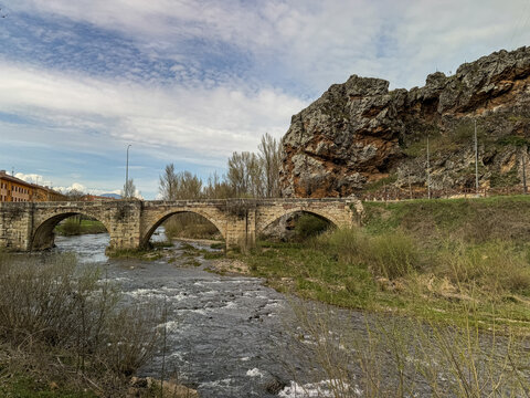 Historic stone bridge over the Pisuerga River in Cervera del Pisuerga